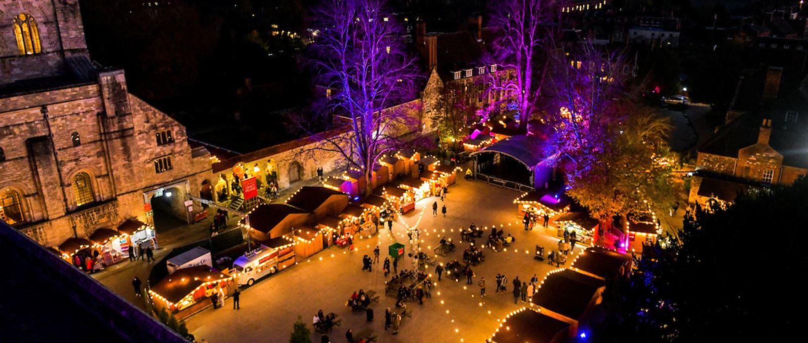 An aerial shot of Winchester Cathedral Christmas Market at night